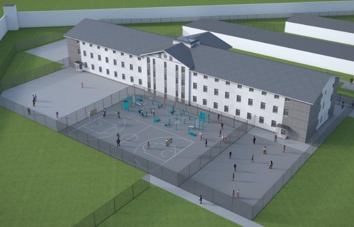 Zdjęcie przedstawia wizualizację kompleksu penitencjarnego Jastrzębie-Zdrój. Poszczególne budynki o różnych kształtach i przeznaczeniu, otoczone są przestrzenią zieloną z rosnącymi drzewami. Zdjęcie przedstawia wizualizację kompleksu penitencjarnego Jastrzębie-Zdrój. Poszczególne budynki o różnych kształtach i przeznaczeniu, otoczone są przestrzenią zieloną z rosnącymi drzewami.