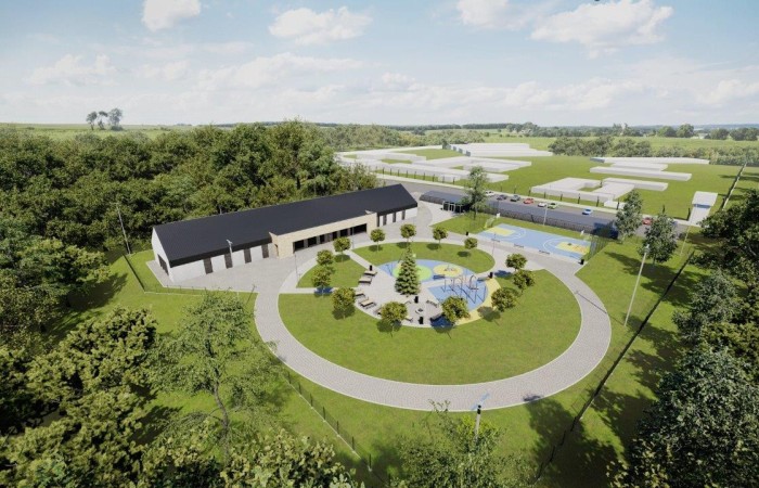 Zdjęcie przedstawia wizualizację kompleksu penitencjarnego Jastrzębie-Zdrój. Poszczególne budynki o różnych kształtach i przeznaczeniu, otoczone są przestrzenią zieloną z rosnącymi drzewami. Zdjęcie przedstawia wizualizację kompleksu penitencjarnego Jastrzębie-Zdrój. Poszczególne budynki o różnych kształtach i przeznaczeniu, otoczone są przestrzenią zieloną z rosnącymi drzewami.