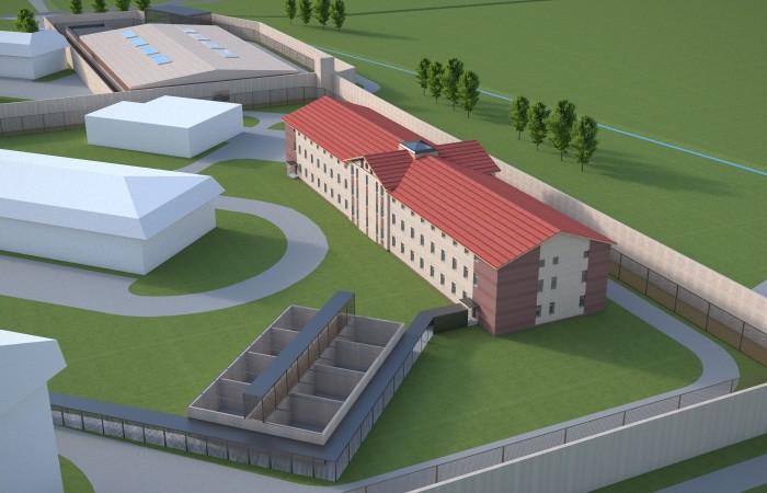 Na zdjęciu wizualizacja Kompleksu Penitencjarnego „Radom”. Widać zespół budynków o różnych kształtach odgrodzonych murem. Wszystko w otoczeniu zieleni oraz drzew. Na zdjęciu wizualizacja Kompleksu Penitencjarnego „Radom”. Widać zespół budynków o różnych kształtach odgrodzonych murem. Wszystko w otoczeniu zieleni oraz drzew.